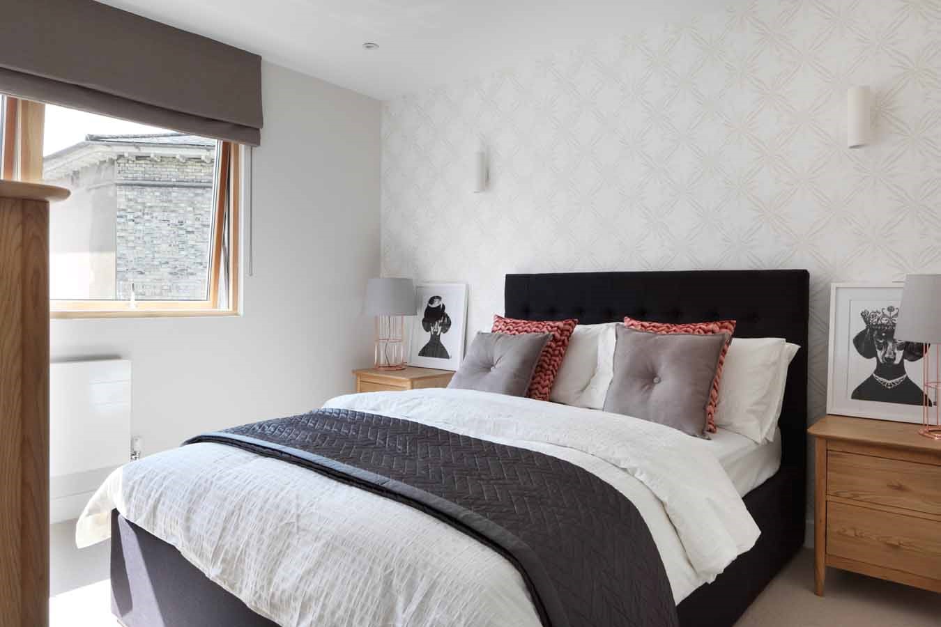 Master bedroom; double bed; upholstered headboard; padded wall paper; roman blinds