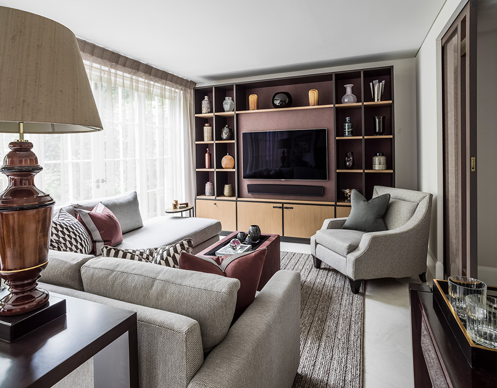 versatile living room with large sofa, tv and built-in storage and display joinery