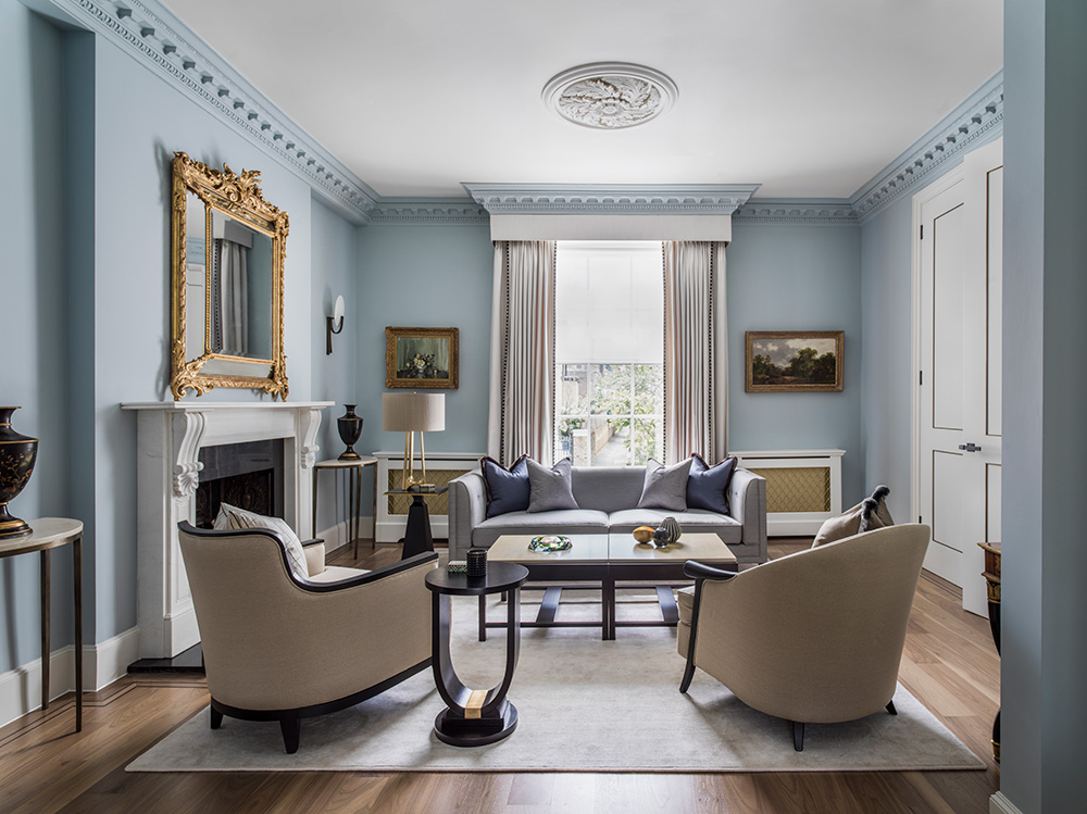 elegant reception room with classic-contemporary furniture and pale blue walls