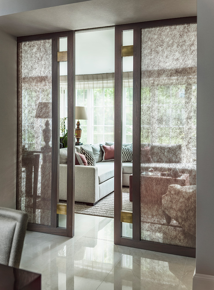 timber pocket doors with glazed glass and metal detail