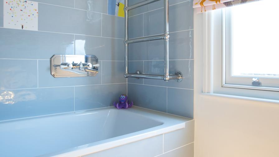 playful hand-made glazed tiles make this children's bathroom a joy. Sensor lights add practicality.