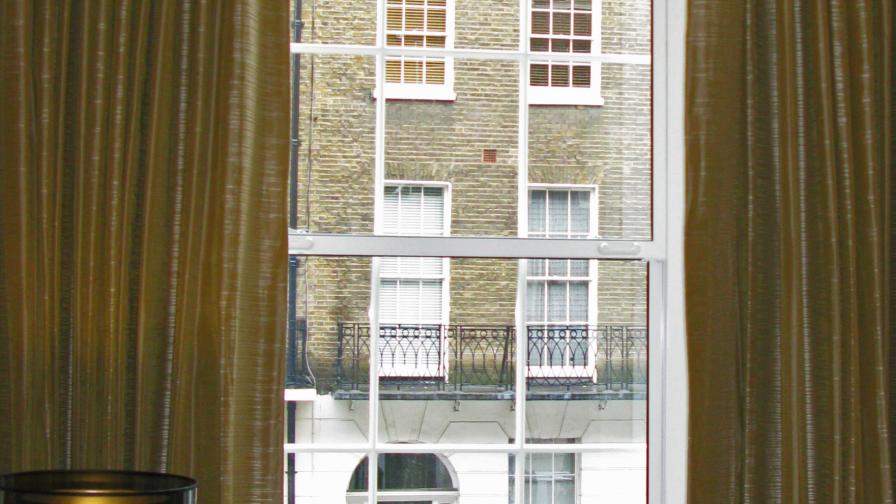 Large vertical sliding secondary glazing at the Arch Hotel, London