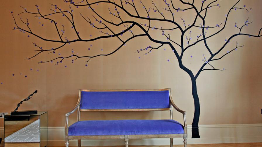 Upon entering the space an embroidered tree bends toward the large adjoining reception room.