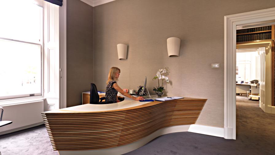 Slatted oak reception desk by Williams Ridout