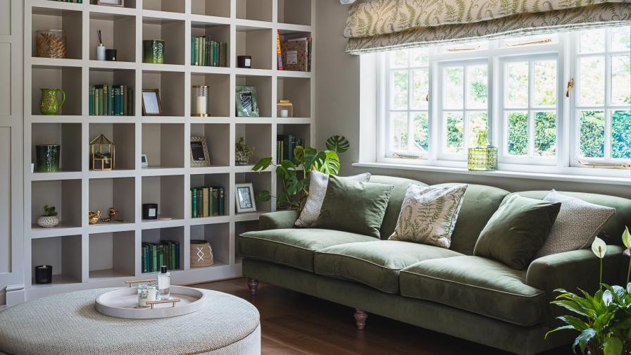 Family TV room in country style using dark green and cream colours.cream 