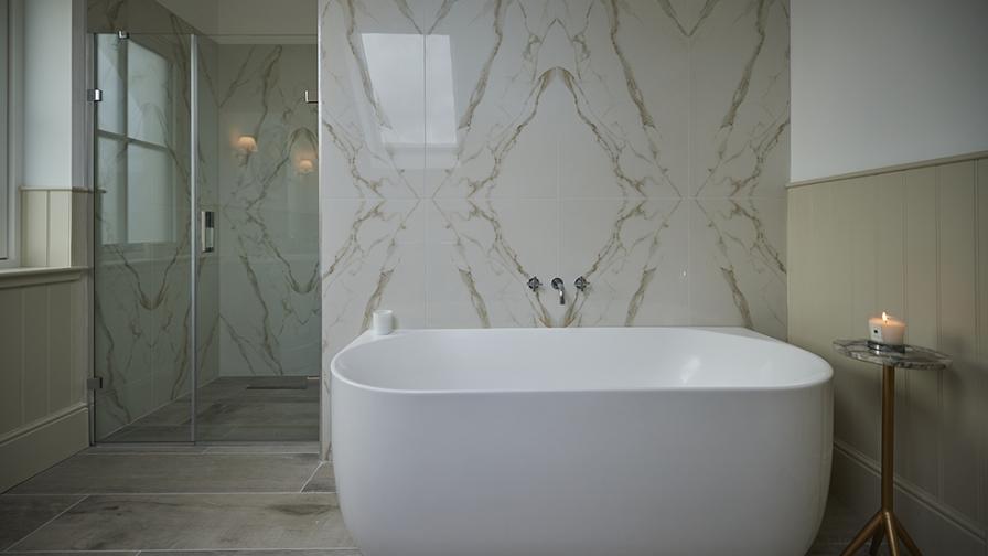 Lapicida bookmatch porcelain marble make a feature in a stunning master bathroom