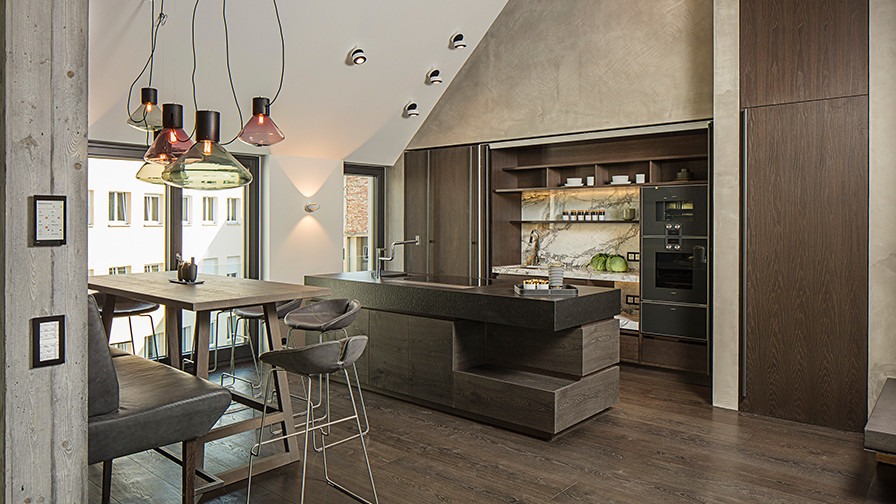 a view of an open space modern kitchen with a wooden floor