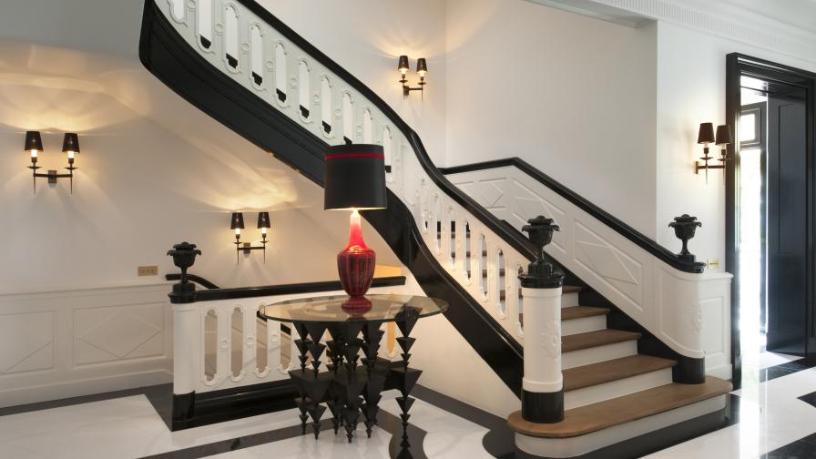 marble hallway acts as the central spine of the villa