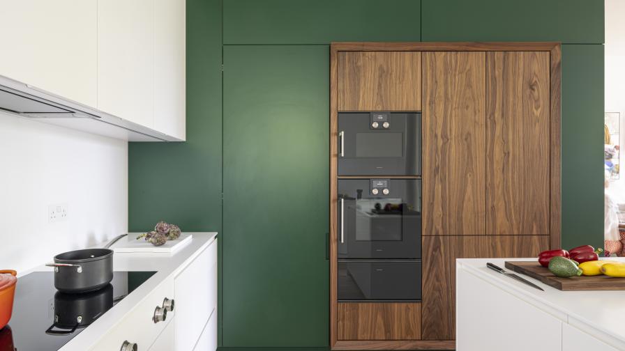 Oven and fridge section with walnut doors and frame