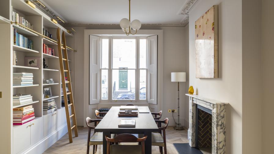 Beautiful dining room with a bespoke hand painted library