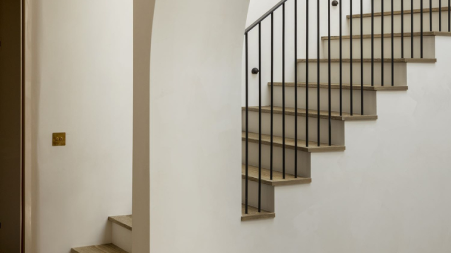 Bespoke staircase with oak treads matching the floor.