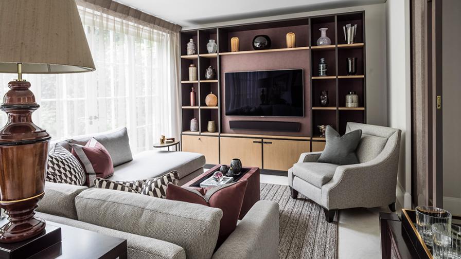 versatile living room with large sofa, tv and built-in storage and display joinery