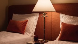 Warm and cosy twin bedroom with cognac tones