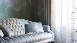 pale blue buttoned sofa