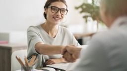 Person at interview, shaking hands