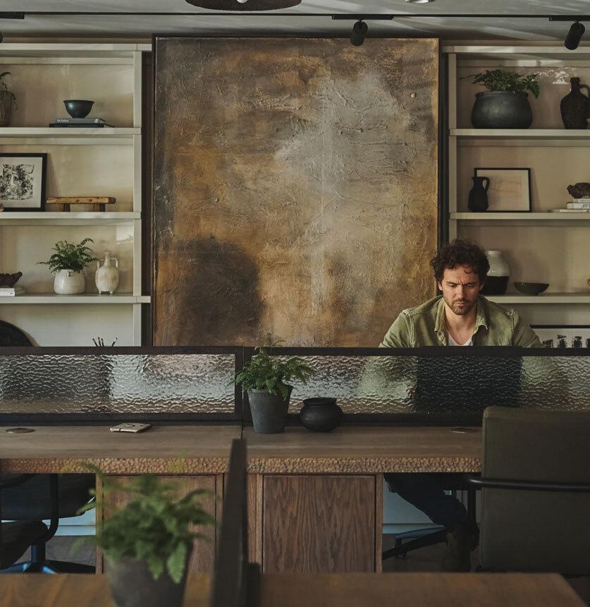 person working at desk in cafe