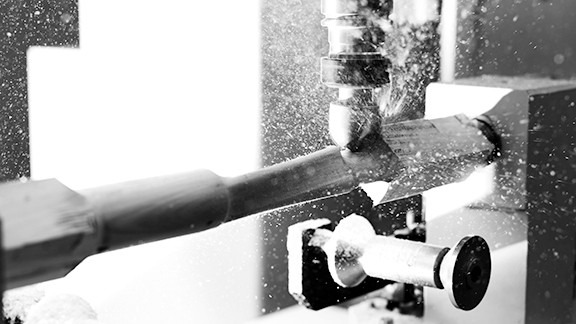 a detailed photo of furniture making machinery in black and white