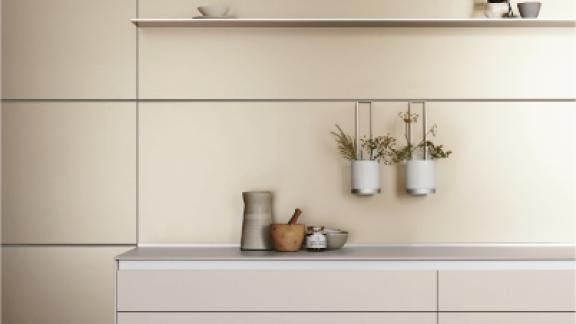 White kitchen cupboards with shelf above